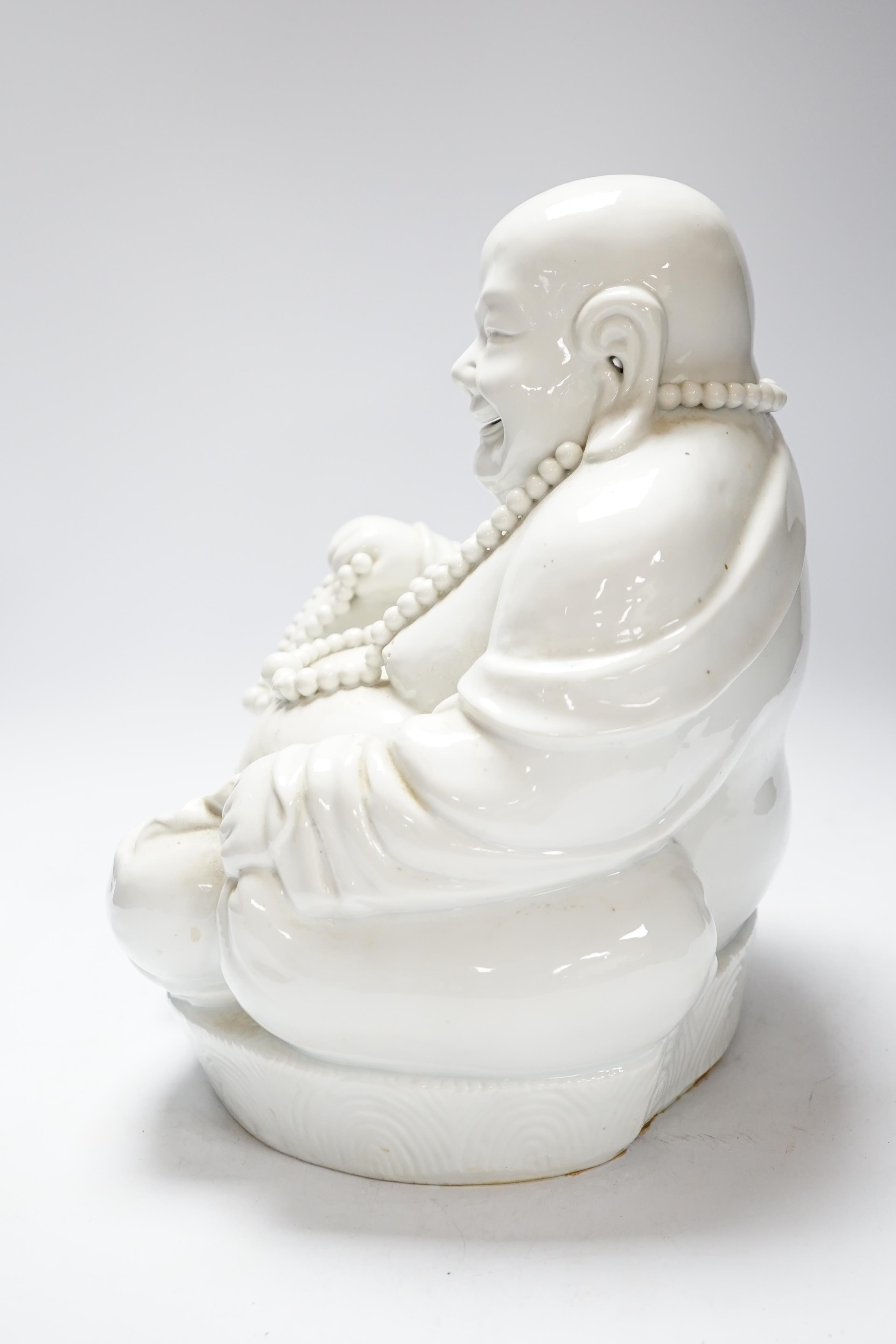 A Chinese Blanc de chine figure of Budai, 32cm high